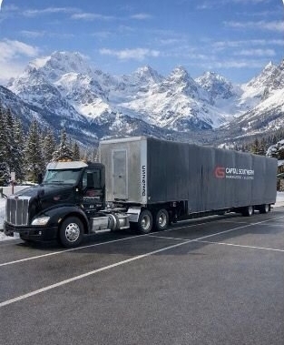 Capital Southern truck driving through mountain scape